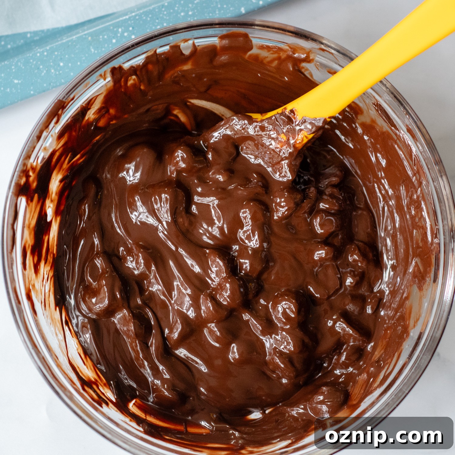 partially melted chocolate chips in a glass bowl.