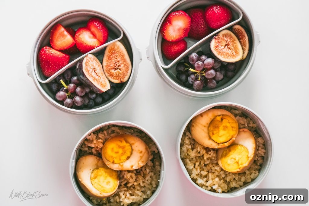 Korean style braised eggs with rice and fresh fruits in my kids lunchboxes