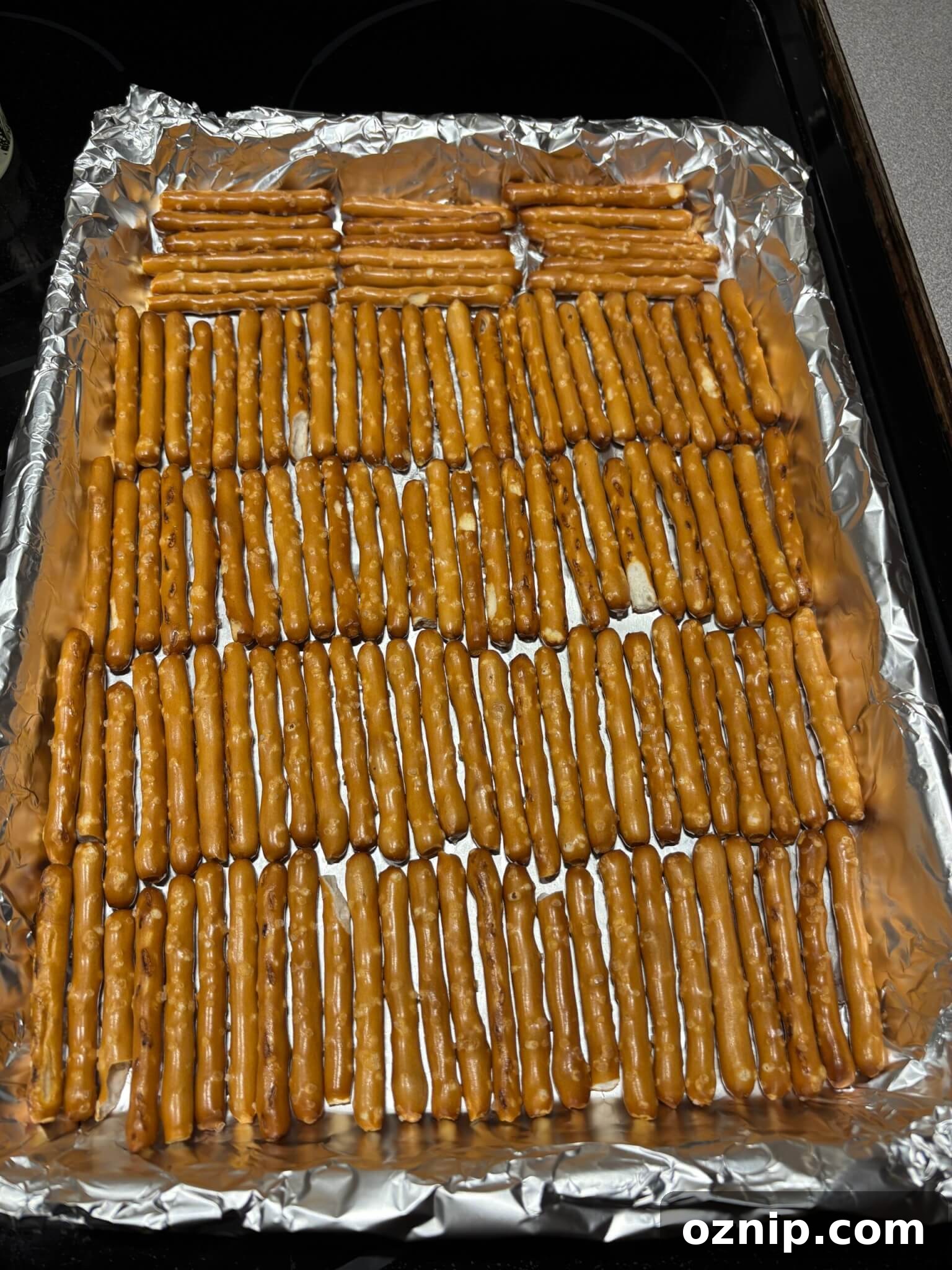 Gluten-Free Christmas Bark Recipe 4 Gluten-free pretzels arranged on a lined baking pan