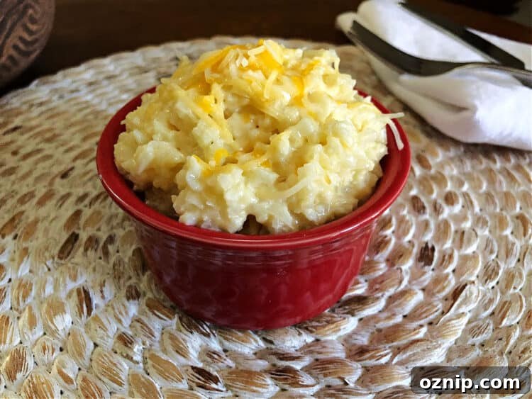 cheesy cauliflower rice in a small red bowl