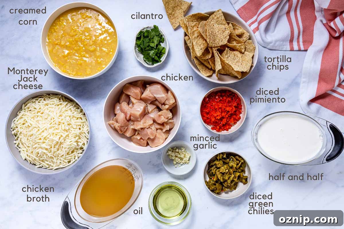 Southwest Chicken Corn Chowder Recipe 2 Ingredients for Southwest Chicken Corn Chowder: chopped chicken, shredded Monterey Jack cheese, creamed corn, minced garlic, chicken broth, green chilies, diced pimento, vegetable oil, half and half, cilantro, and tortilla chips.
