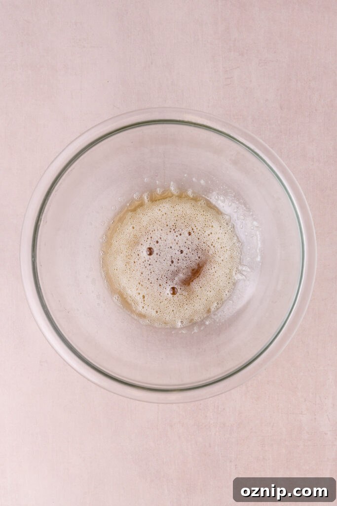 Buttery Crunch Cookies: Chewy Centers, Crispy Edges 5 Brown butter in a glass mixing bowl cooling down to make cookie dough with.