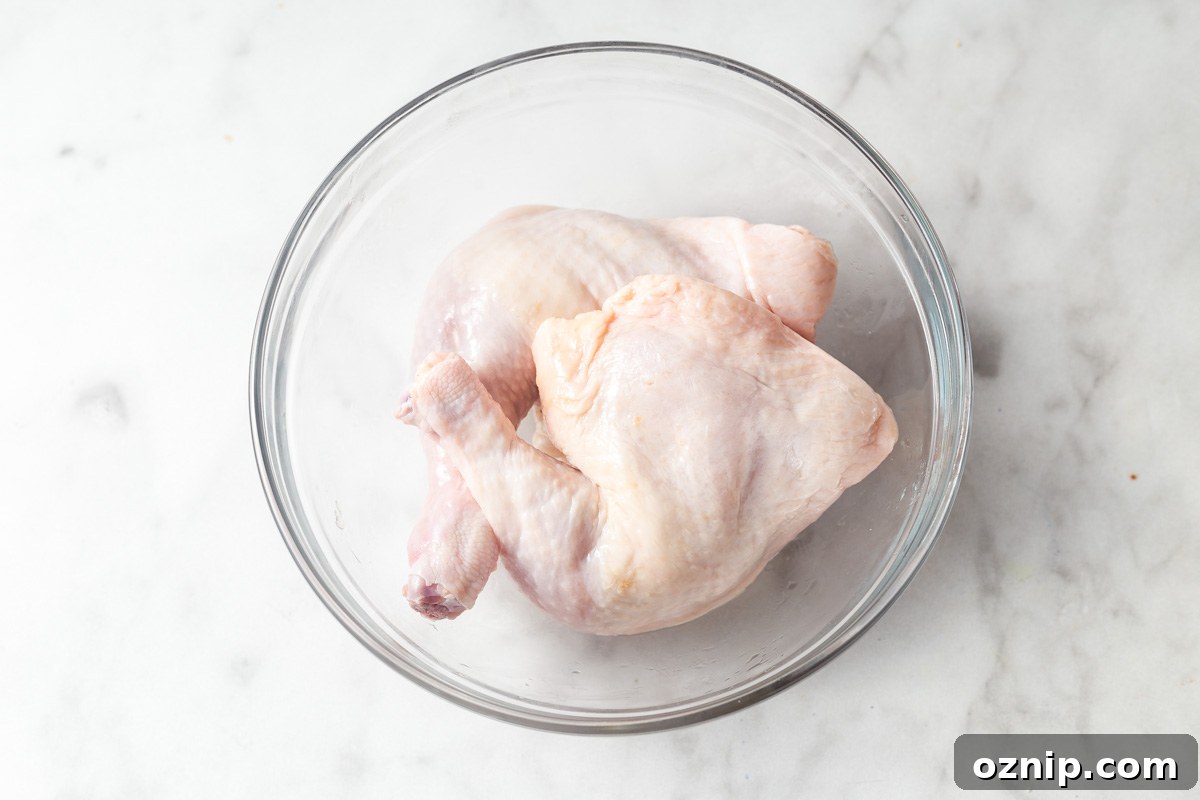 chicken leg quarters in a large bowl.