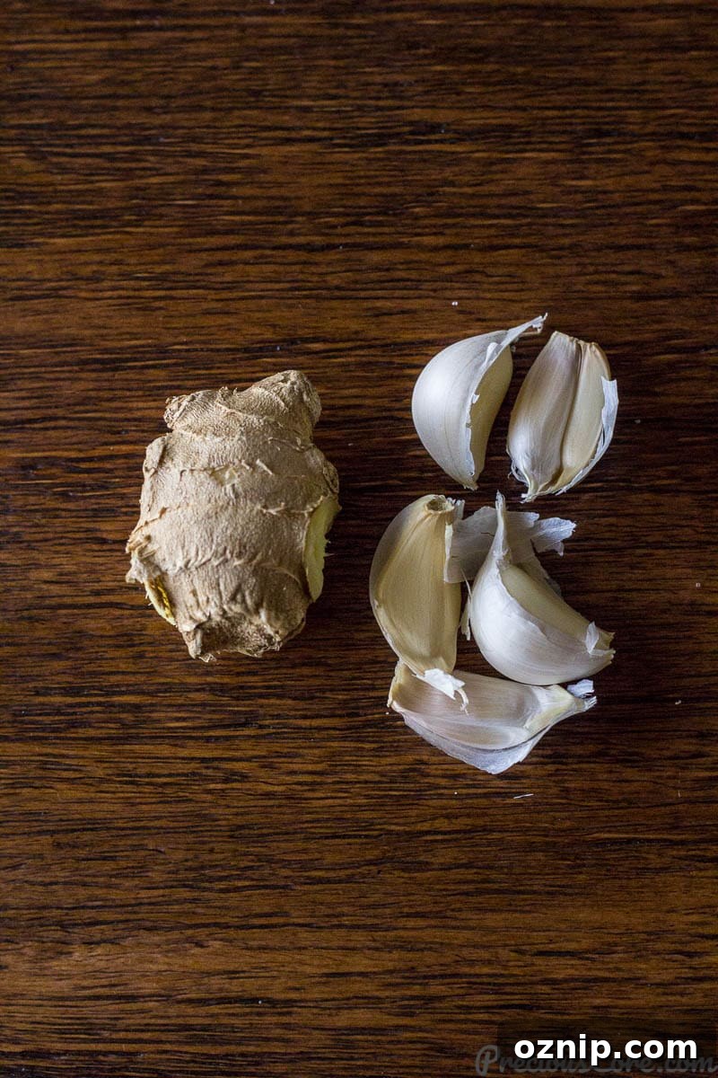 Ginger and garlic on a wooden surface.