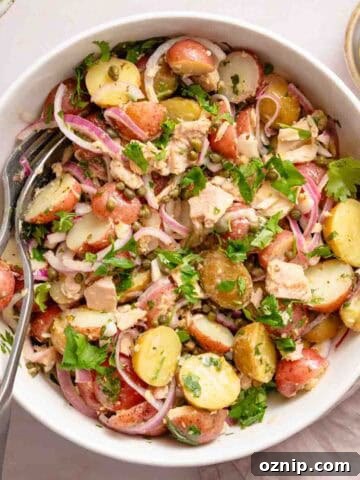 potato and tuna salad in white bowl
