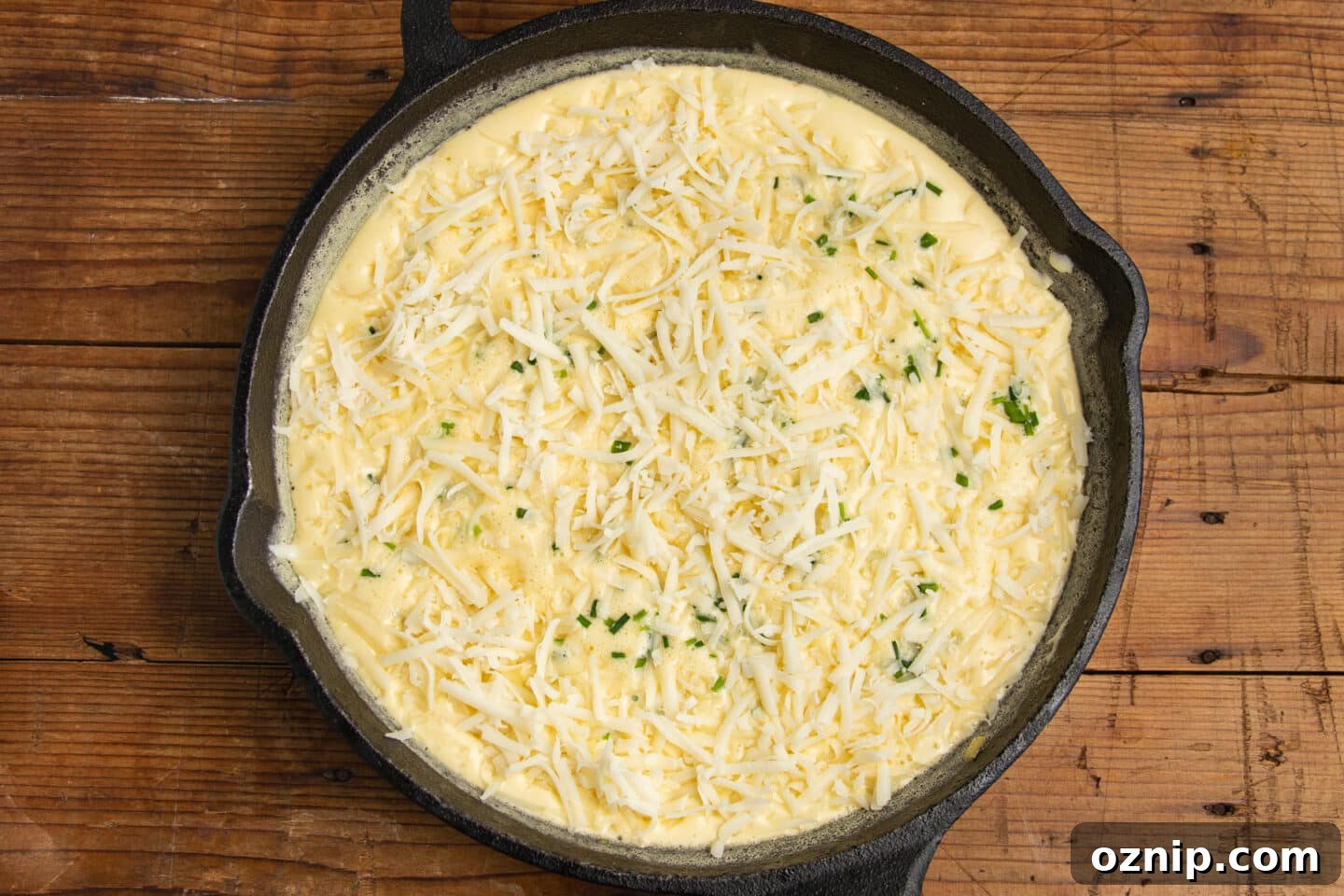 This is a picture of the frittata with the cheese and chives added.