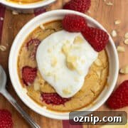 This is a picture of the white chocolate raspberry baked oats ready to eat with yogurt on top.