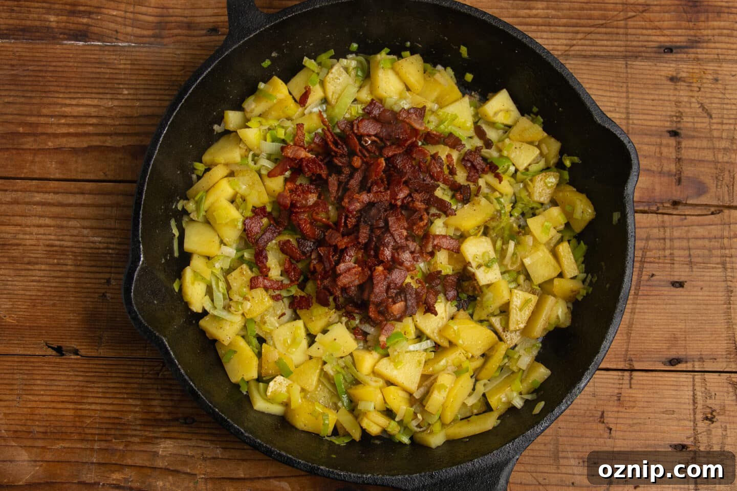 This is a picture of the skillet with crispy bacon added.