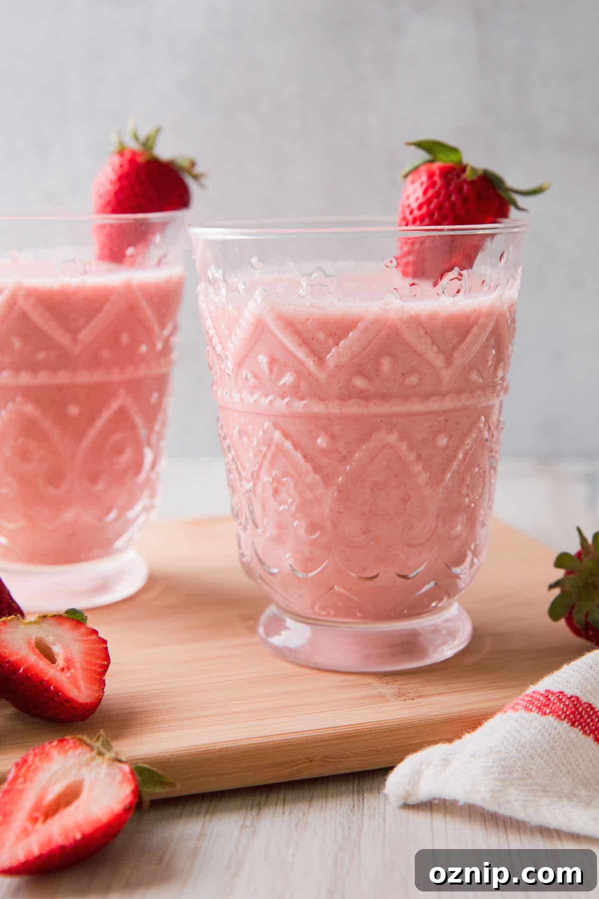 a pink smoothie in a glass