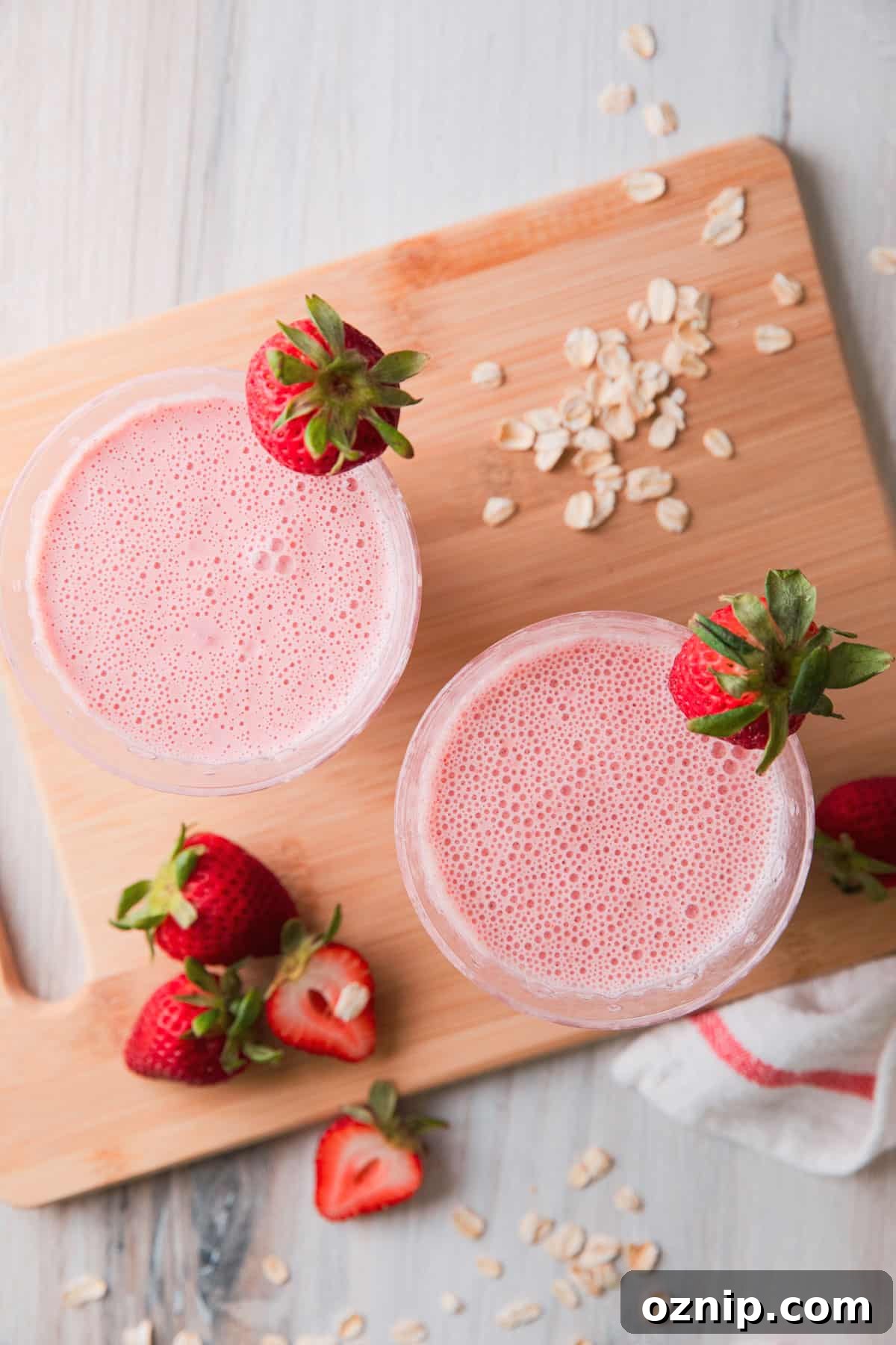 2 glasses with  pink smoothie 