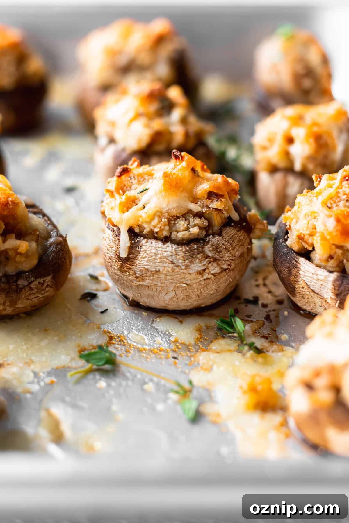 cream cheese stuffed mushrooms on a baking tray