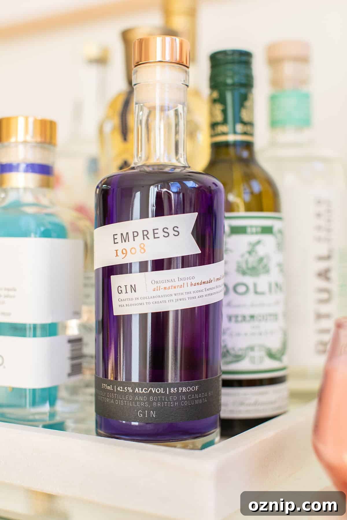 Empress Gin Cocktails for Stunning Color Changing Drinks 2 Bottle of Empress gin on a bar cart