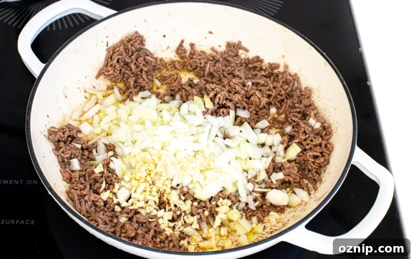 Slow Cooker Lasagna Recipe with Rich Meat Sauce 16 Ground beef cooking with onion and garlic