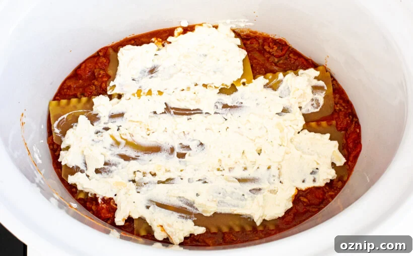 Slow Cooker Lasagna Recipe with Rich Meat Sauce 19 Layering lasagna in a slow cooker