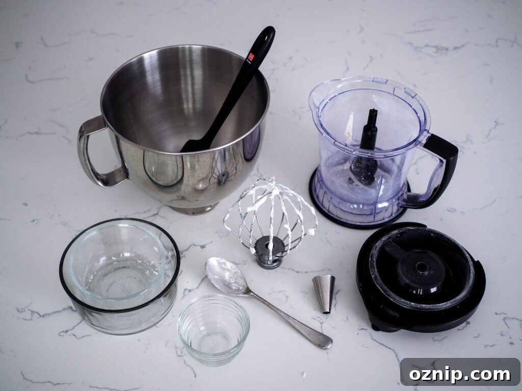 A variety of dishes used to make birthday cake macaron shells.