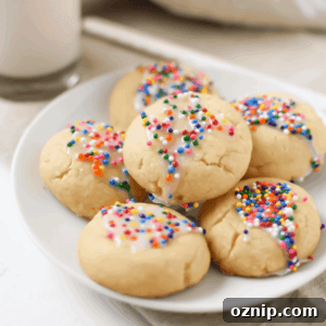 Cannabis Anise Spritz Cookies Recipe 7 A picture of several Italian Spritz Cookies with Anise on a white plate.