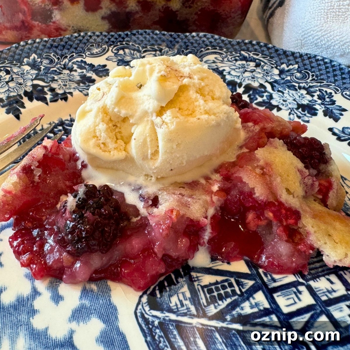 the best easy blackberry cobbler with a scoop of vanilla ice cream on top