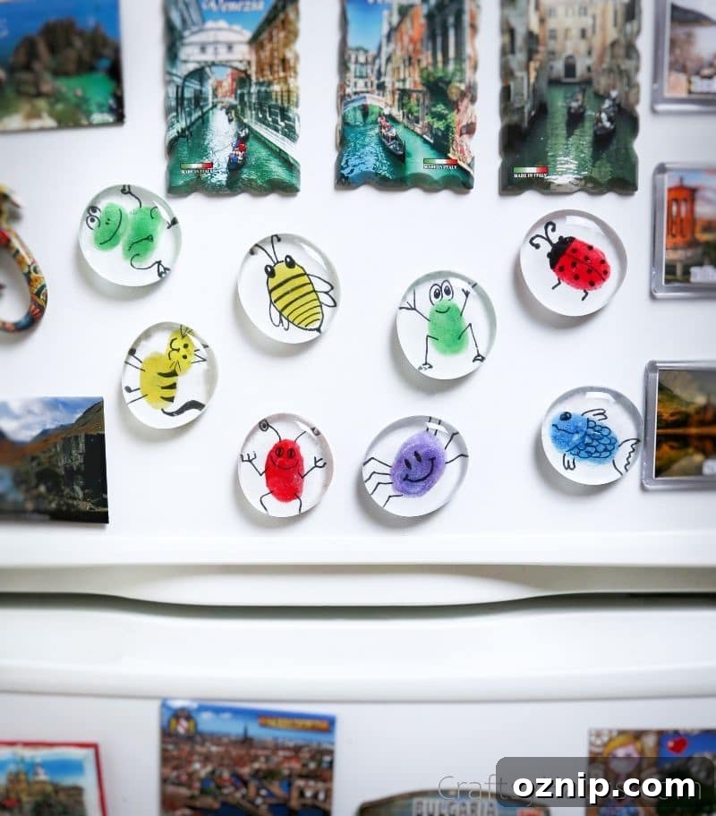 DIY Fingerprint Glass Magnets for Kids Keepsakes 3 fingerprint magnets on fridge
