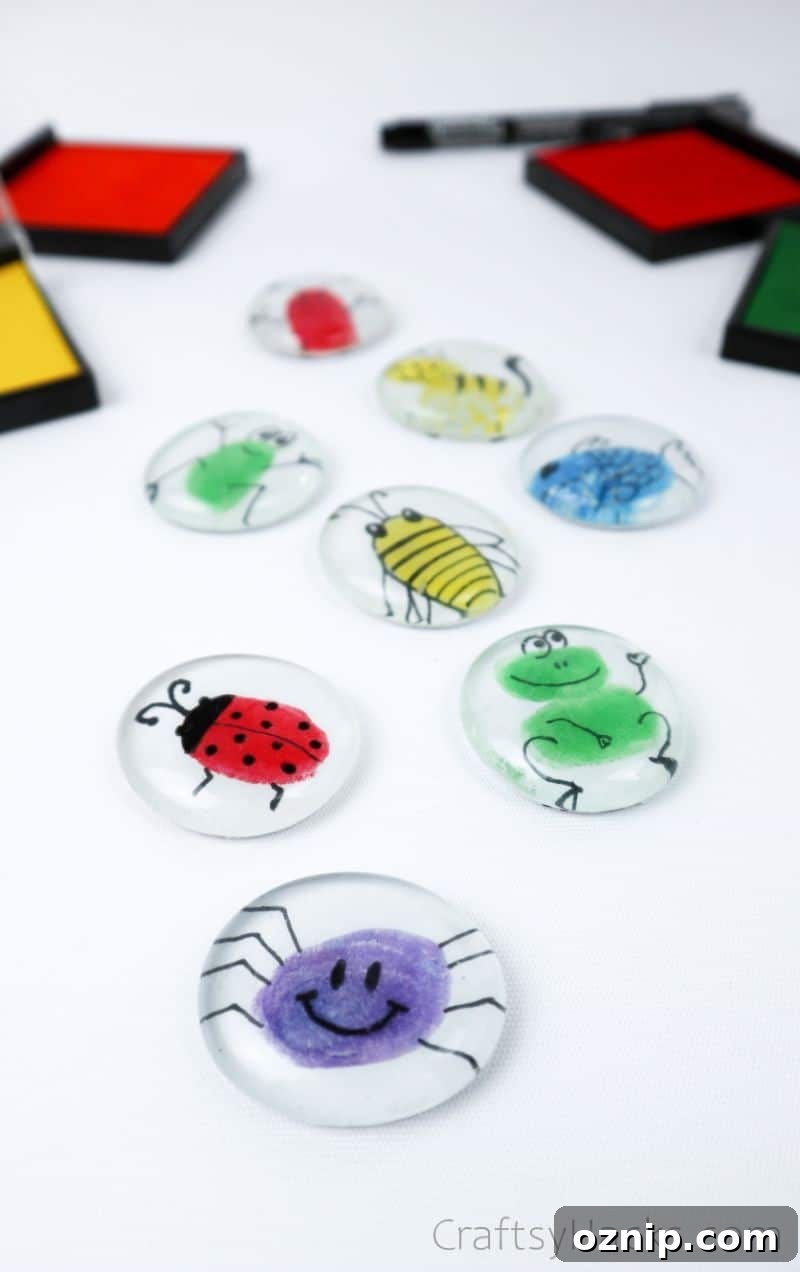 DIY Fingerprint Glass Magnets for Kids Keepsakes 9 8 fingerprint magnets layed out