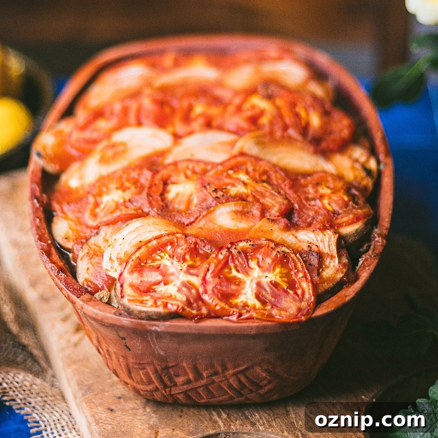 One pot Egyptian Potato and Tomato Dish in a large clay dish