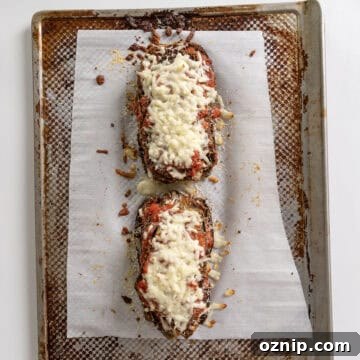 Eggplant layers topped with mozzarella and parmesan, toasted in the oven.