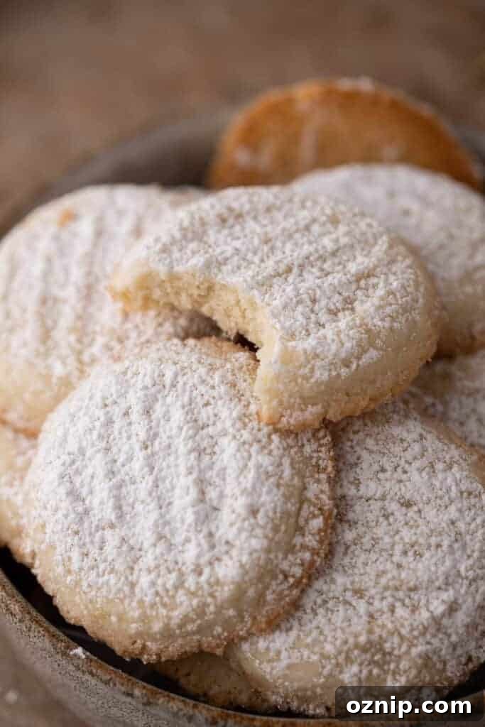 Melting Moments Cookies Recipe That Melt in Your Mouth 12 close up of a loosely piled group of cornstarch cookies