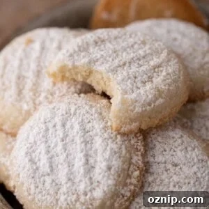 Melting Moments Cookies Recipe That Melt in Your Mouth 13 close up of a loosely piled group of cornstarch cookies