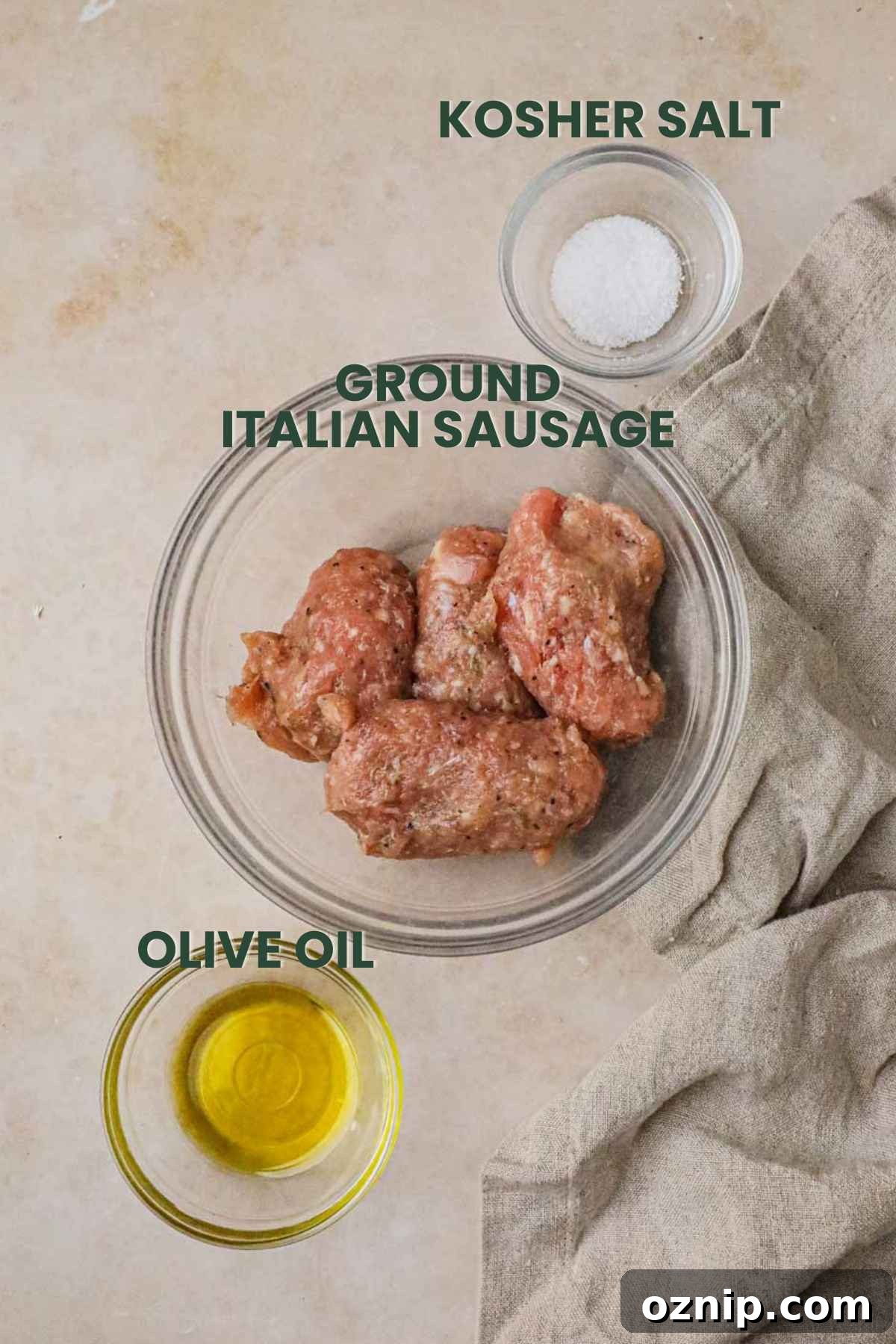 Ingredients to make ground Italian sausage, olive oil, ground italian sausage, kosher salt.