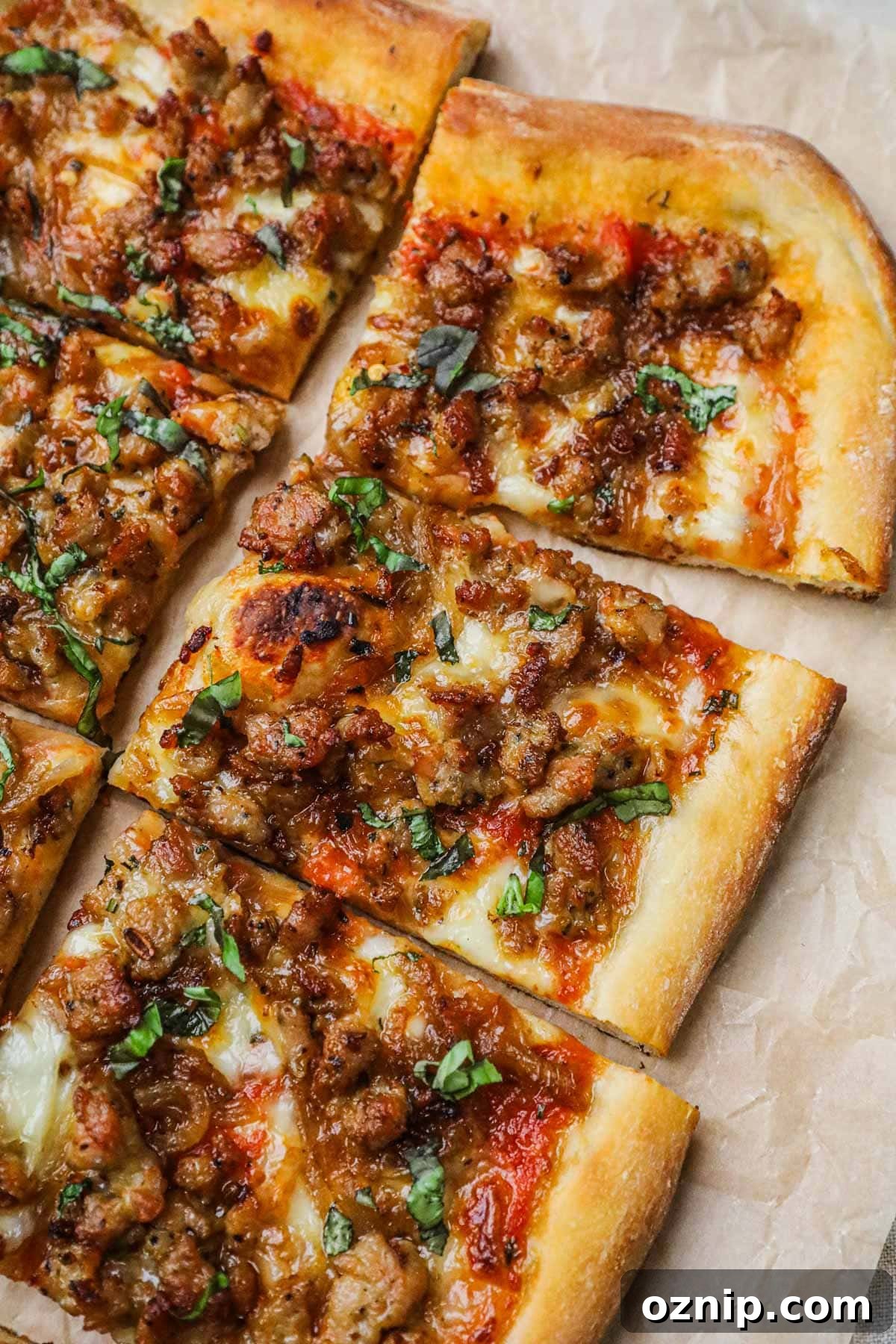 Caramelized ground Italian sausage on homemade pizza.