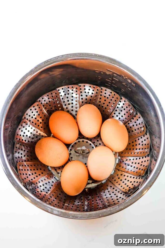 Classic Deviled Eggs Recipe for Parties 7 Six eggs in a steamer basket in an instant Pot liner.