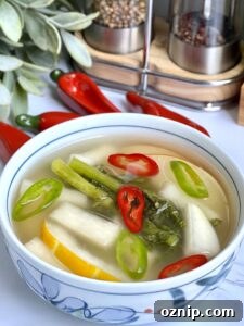 Quick Dongchimi: Radish Water Kimchi Recipe 14 Serving dongchimi with sliced chilies