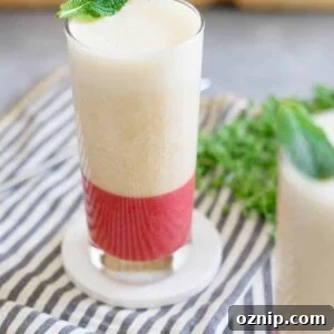 Layered strawberry ginger peach smoothie