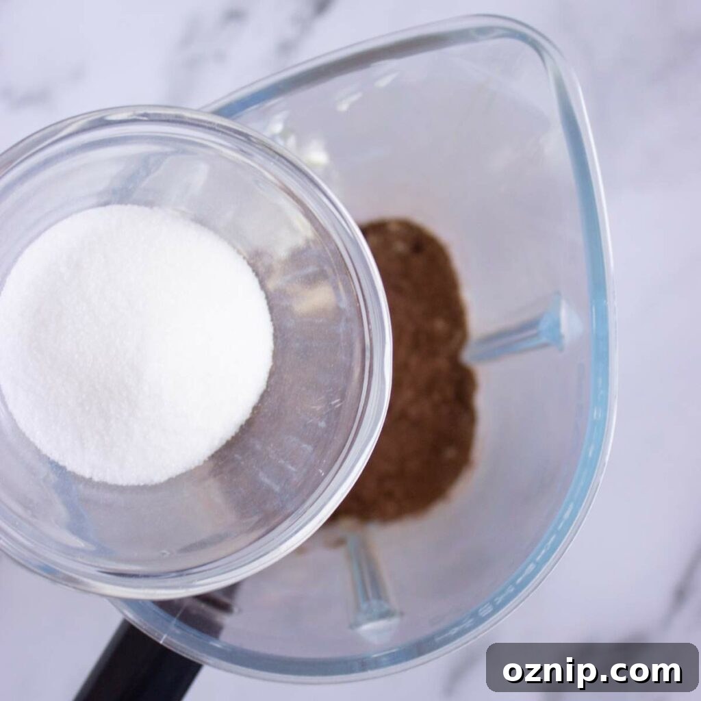 Low Carb Sugar Free Protein Pudding Recipe 10 Sweetener is being poured into a blender.