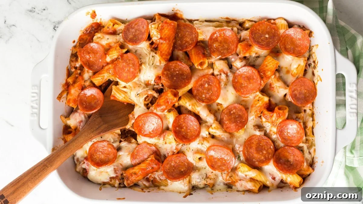 Pepperoni pizza casserole in a white baking dish.