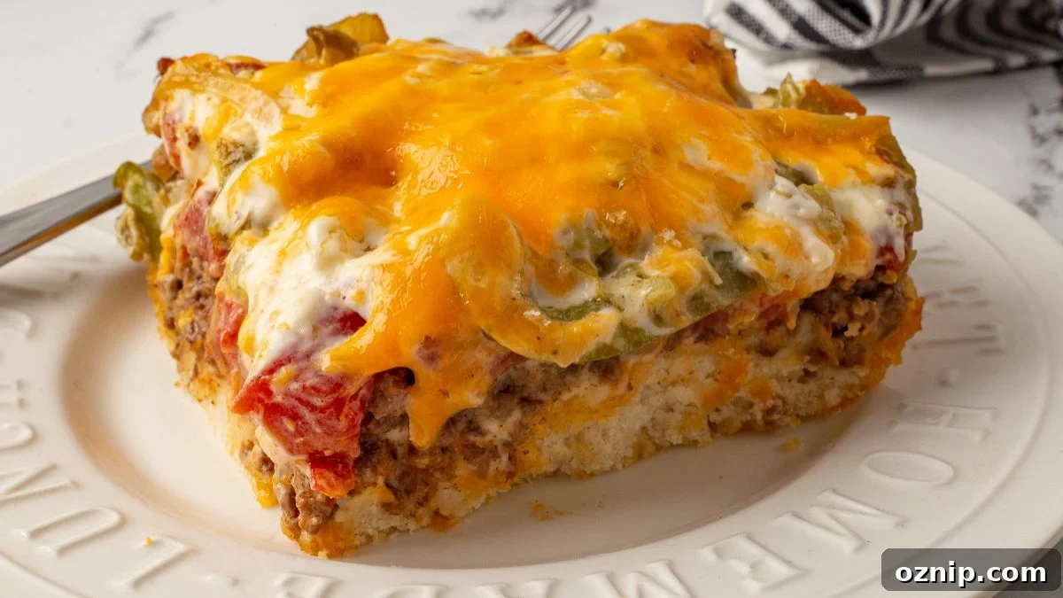 John Wayne Casserole served on a white plate with a fork on the side.