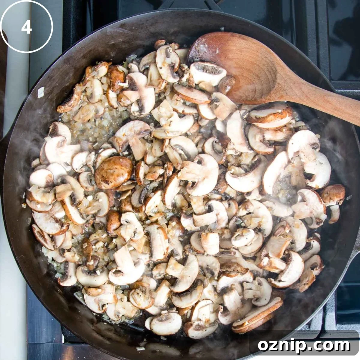 Cast iron skillet with sauteed mushrooms and onions.