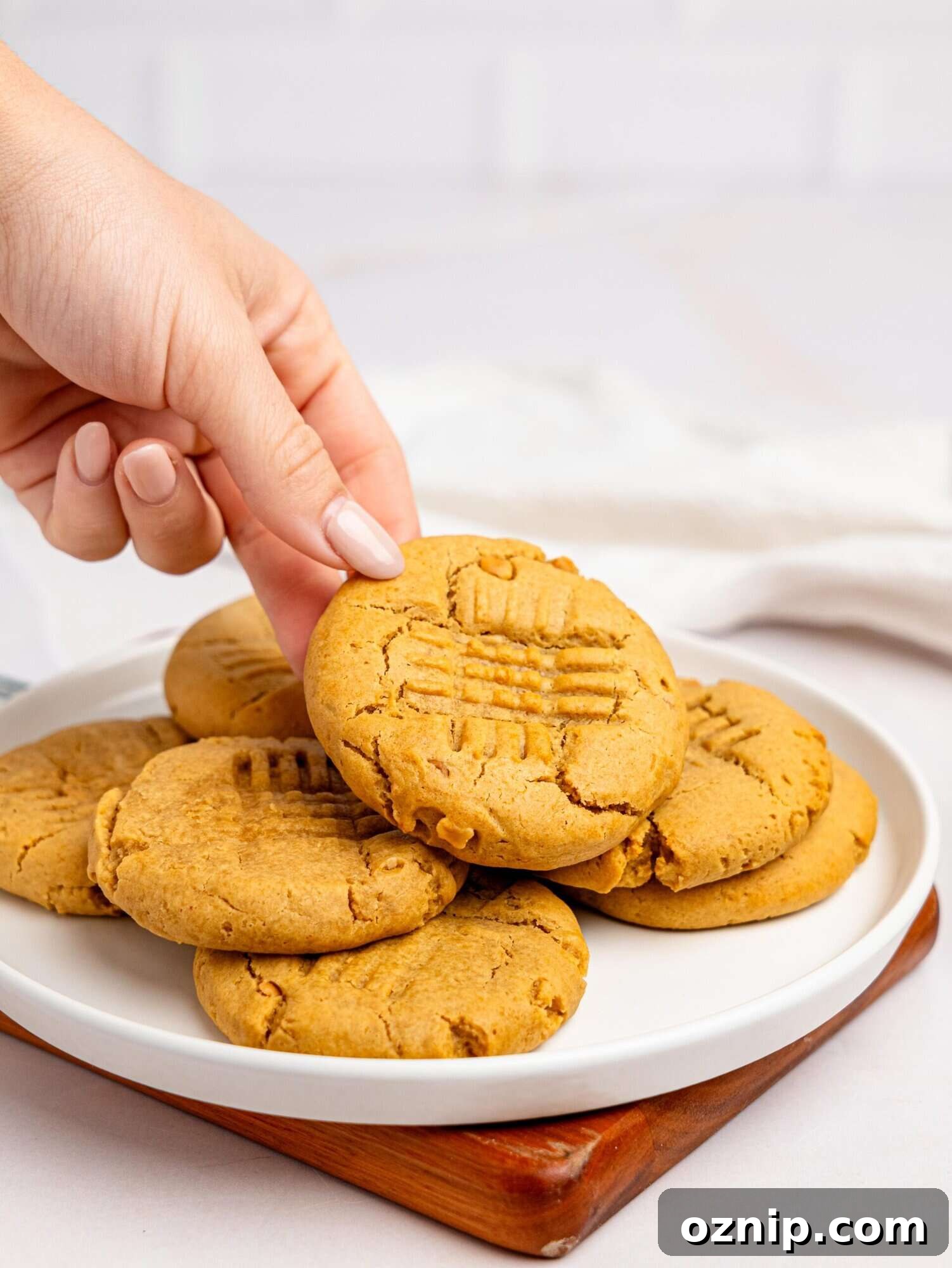 Peanut butter cookies no butter on a white plate.