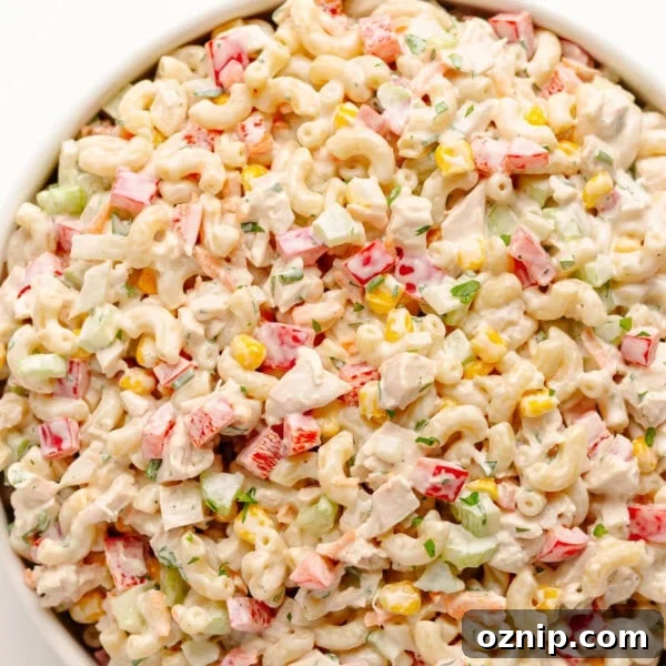 Chicken macaroni salad in a white serving bowl.