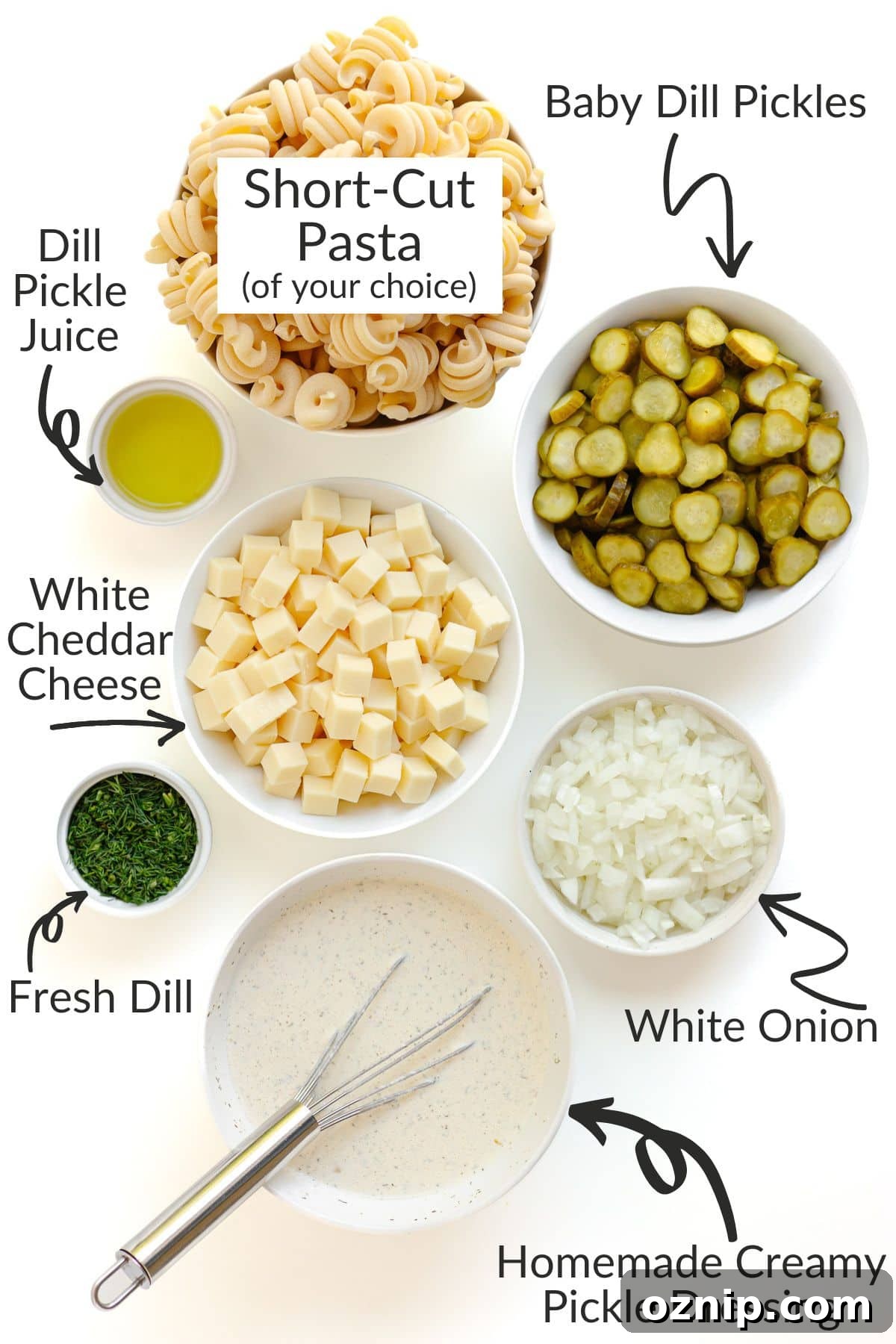 Labelled photo of ingredients needed to make dill pickle pasta salad.