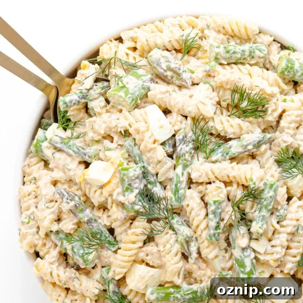 Salmon and asparagus pasta salad with a creamy lemon dill dressing.