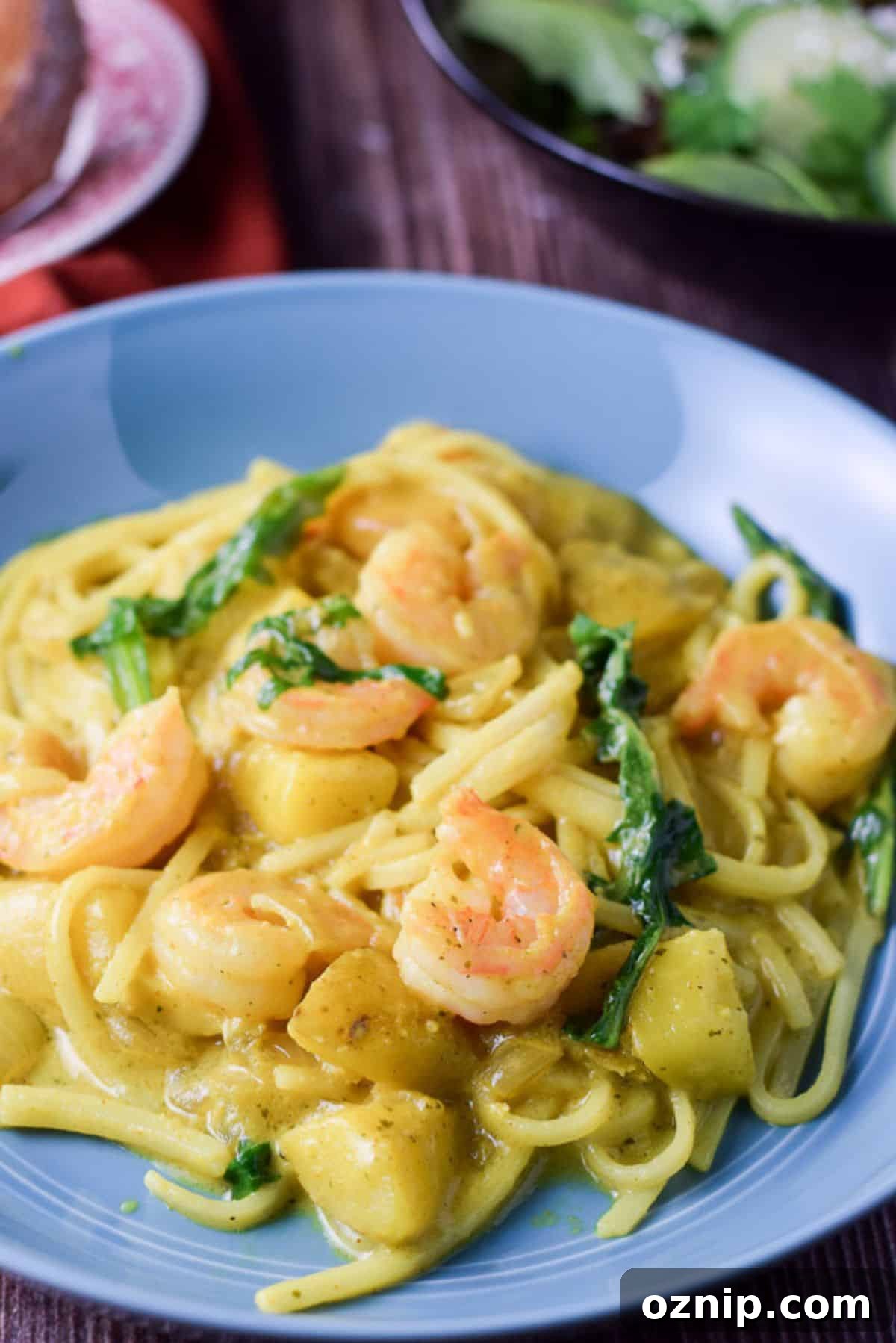 Closer view of the shrimp noodles in a blue deep plate